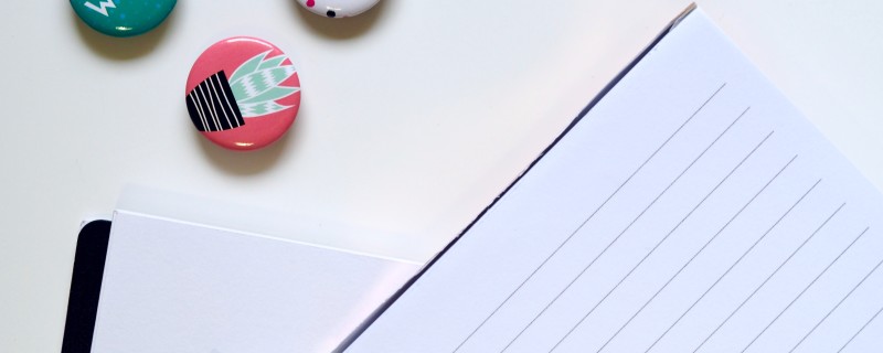 Notepad with pen on desk