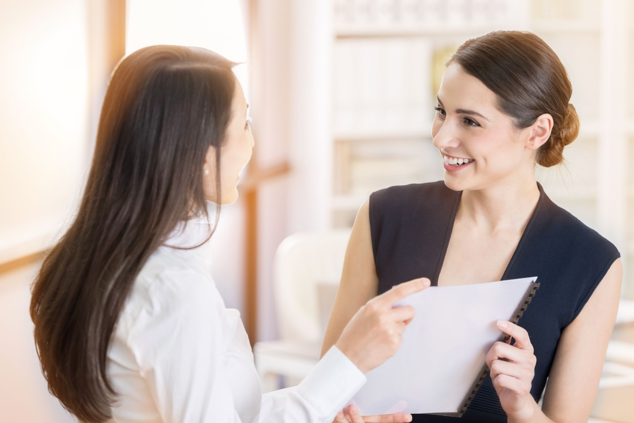 administrative assistant communicating with her boss