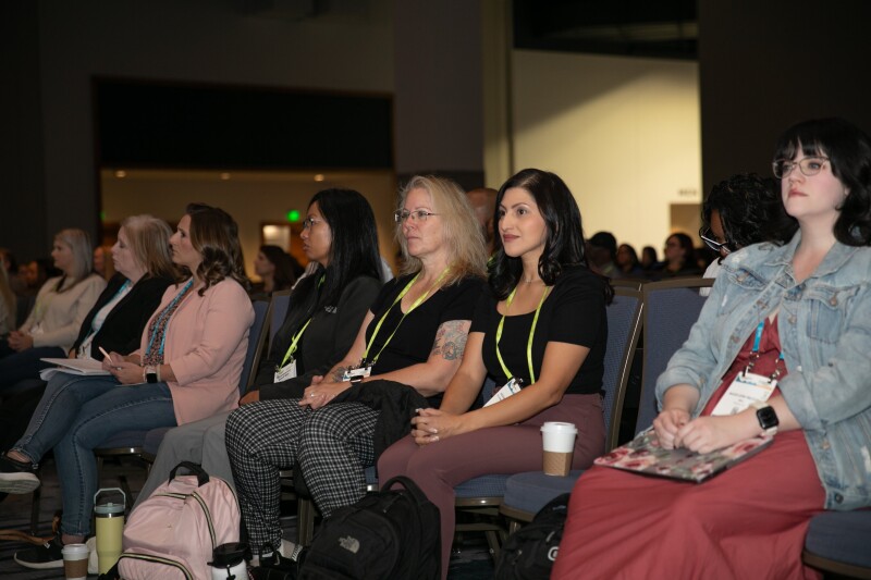 Attendees listening to panel