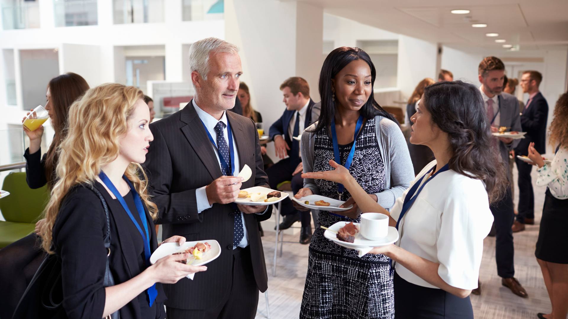 A group of administrative professionals at a professional association gathering. They are connecting, networking, and expanding their careers.