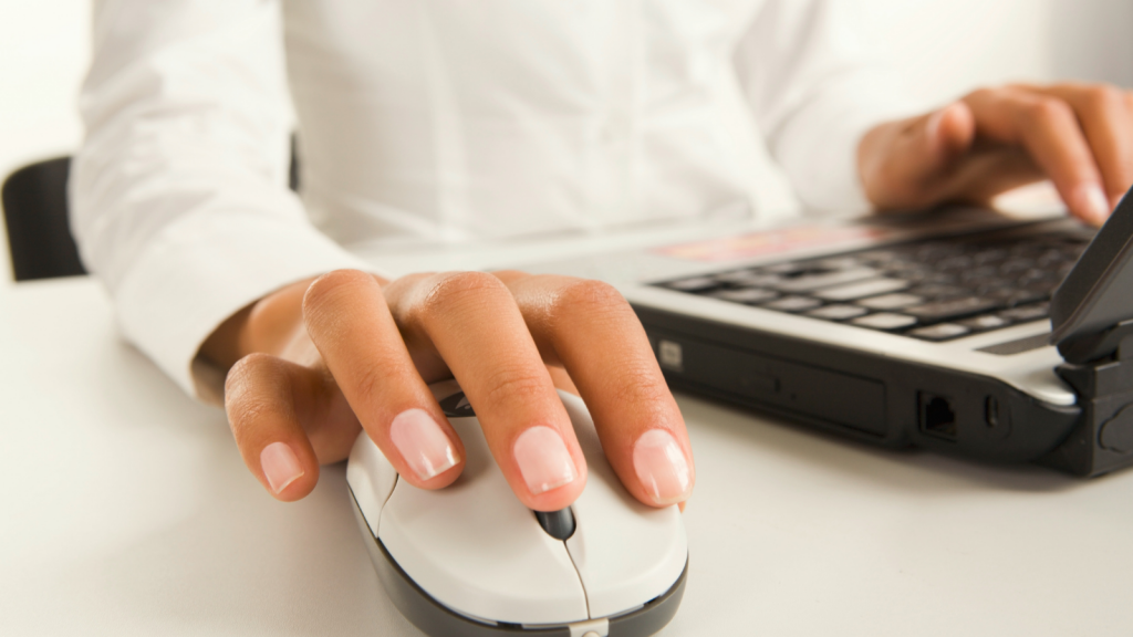 Administrative professional scheduling on laptop