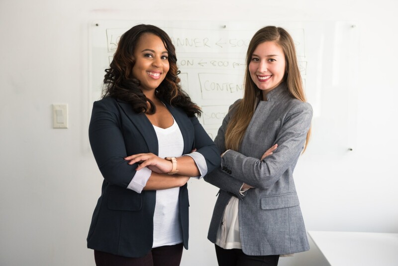 coworkers smiling and posing for a picture together