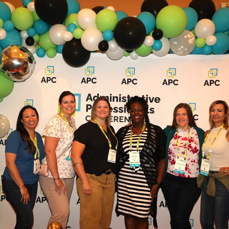 APC 2023 attendees posing for a photo