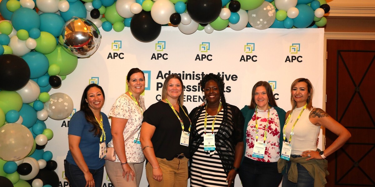 APC 2023 attendees posing for a photo
