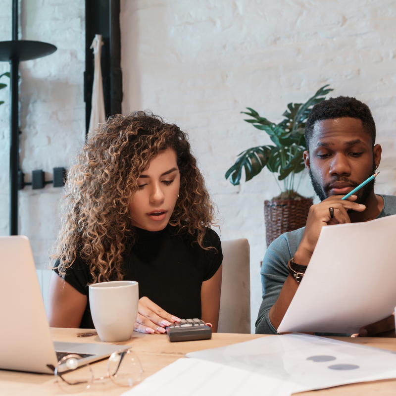 coworkers looking at budget