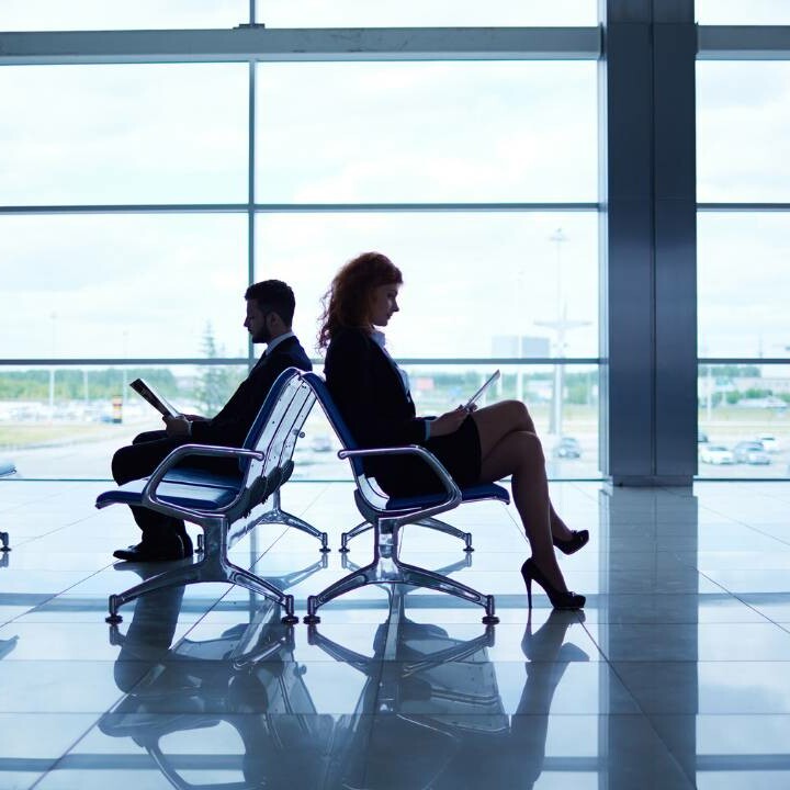 Business managers working in the airport terminal