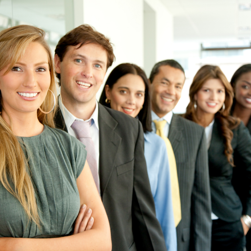 Group of professionals lined up and smiling