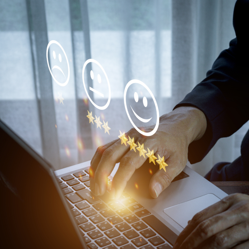 Hands at keyboard with stars and satisfactory faces indicating that this person is taking a survey.