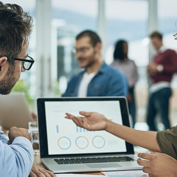 Two coworkers reviewing their data driven analysis