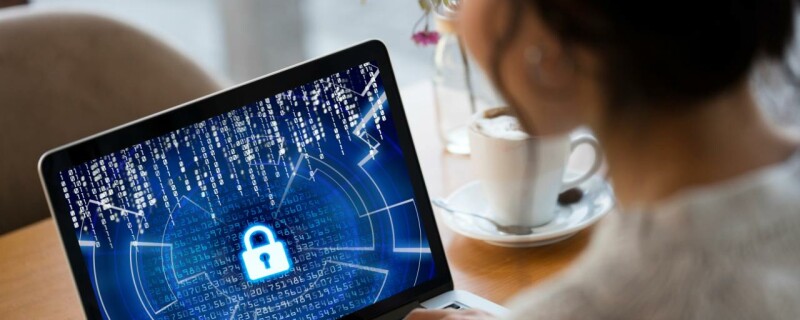 An admin professional looks up cybersecurity options on their work computer.