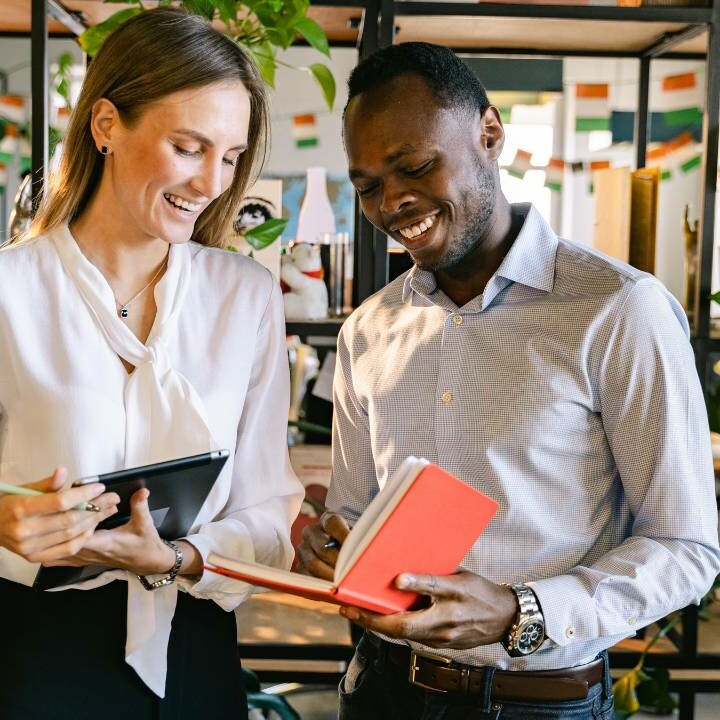 An employer and employee going over employee reviews.