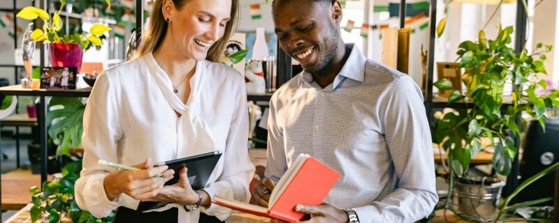 An employer and employee going over employee reviews.