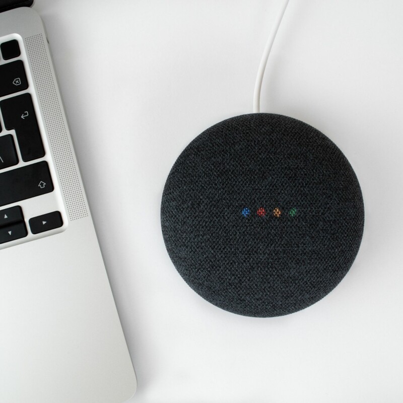 Google Assistant next to laptop