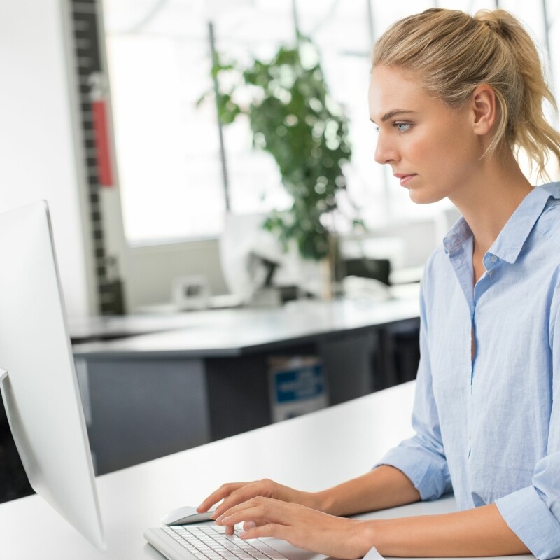 executive assistant working in computer at her office