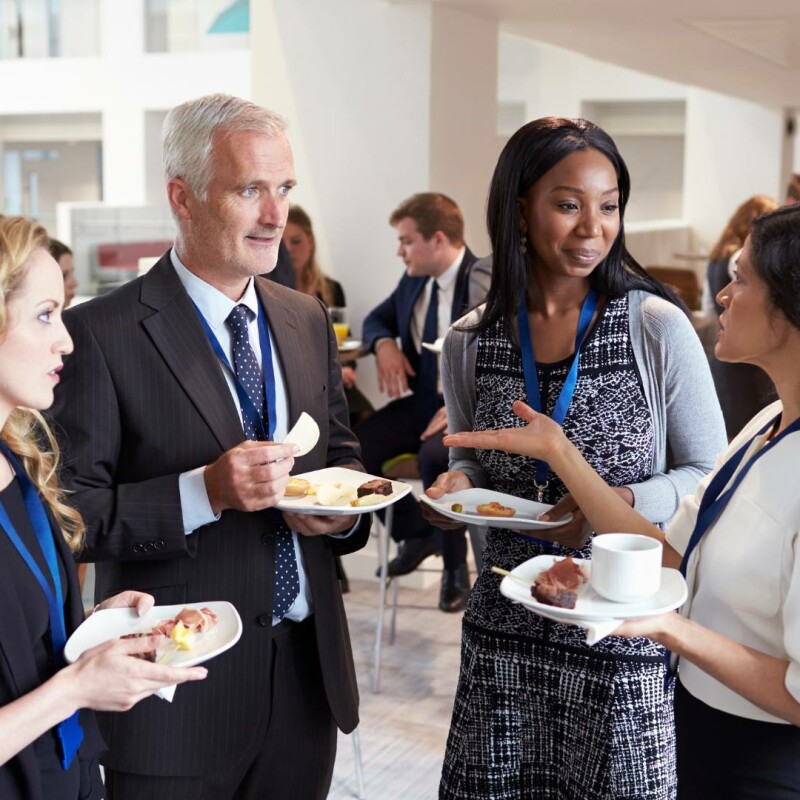 A group of administrative professionals at a professional association gathering. They are connecting, networking, and expanding their careers.