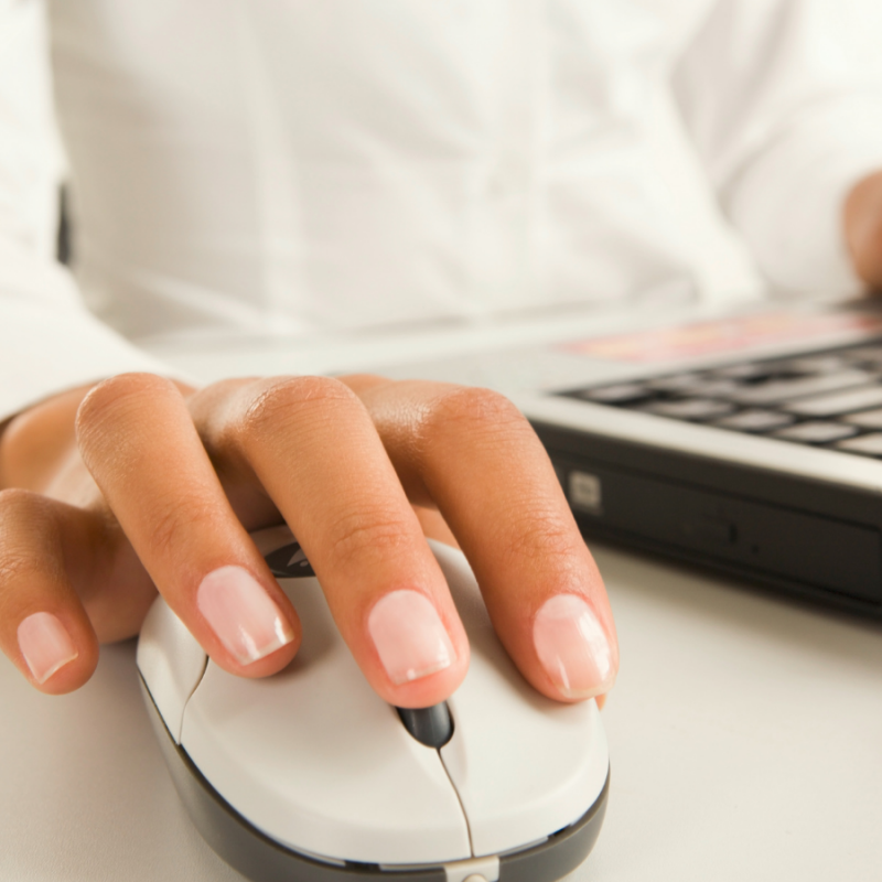 Administrative professional scheduling on laptop