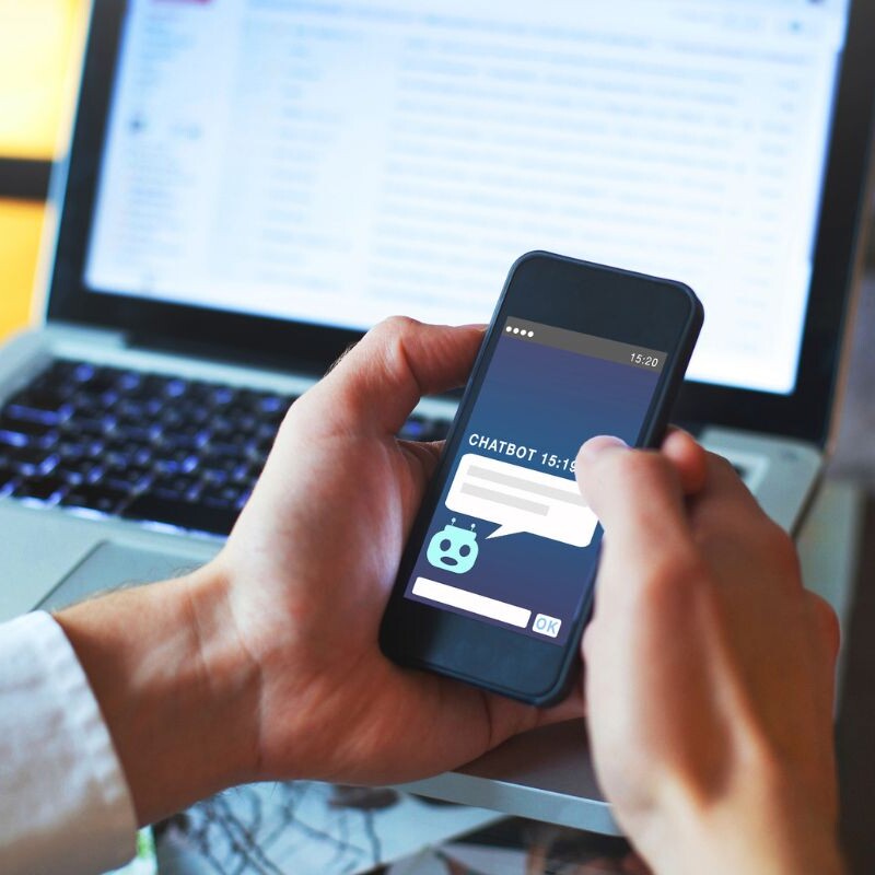 Professional engaging with an AI chatbot.