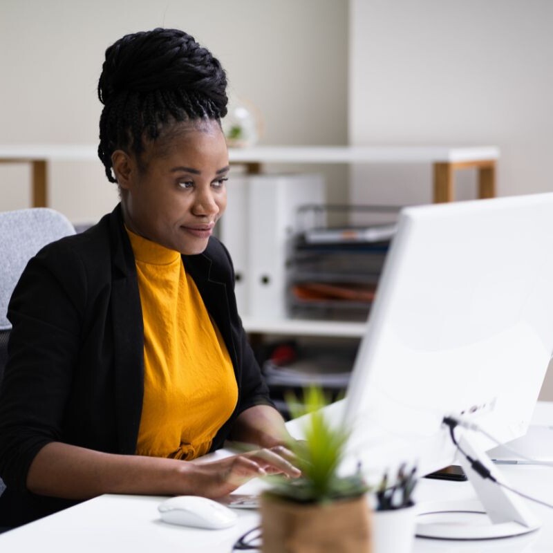 Admin Using Google Gemini on Office Desktop Computer