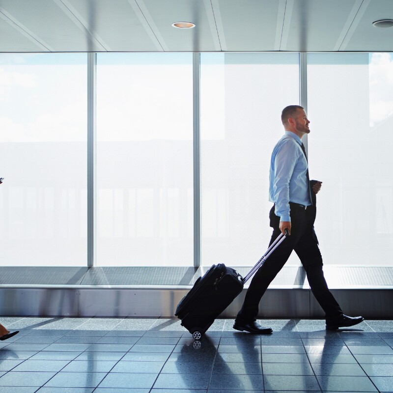 executives traveling through airport