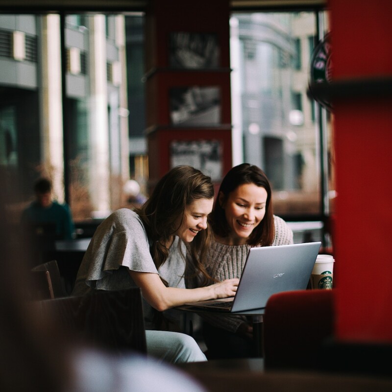 assistants working on laptop together