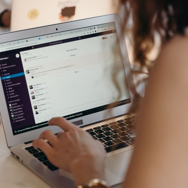 Remote worker collaborates with colleagues via instant messager.
