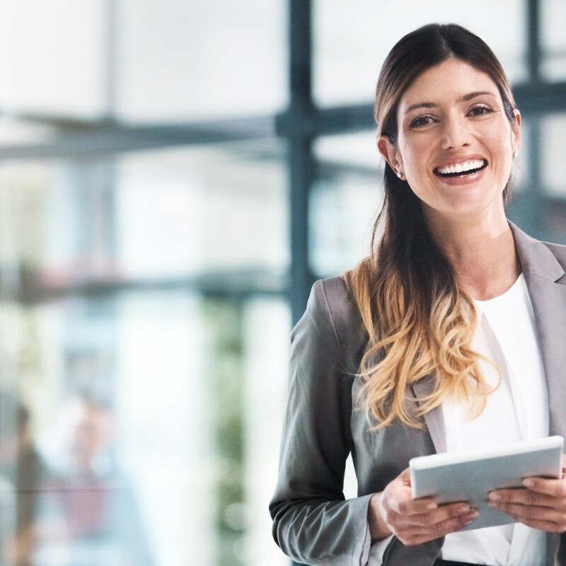 personal assistant smiling with notepad