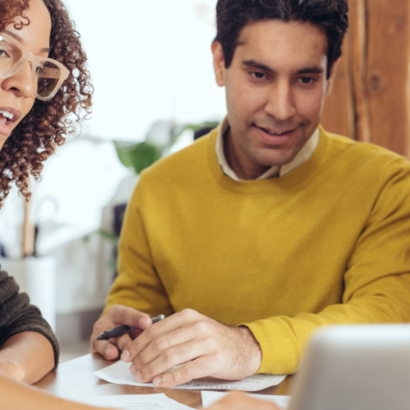 coworkers looking at a computer