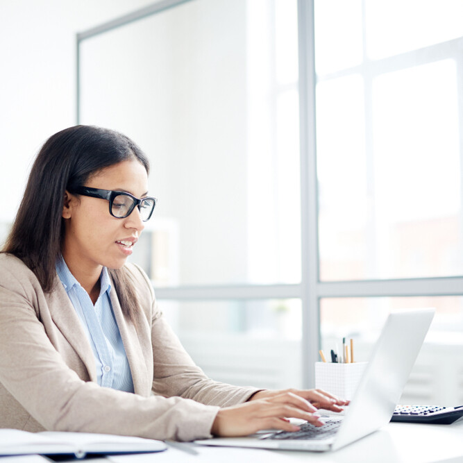 Administrative professional building her professional portfolio to showcase her resume, certifications, work samples, and more