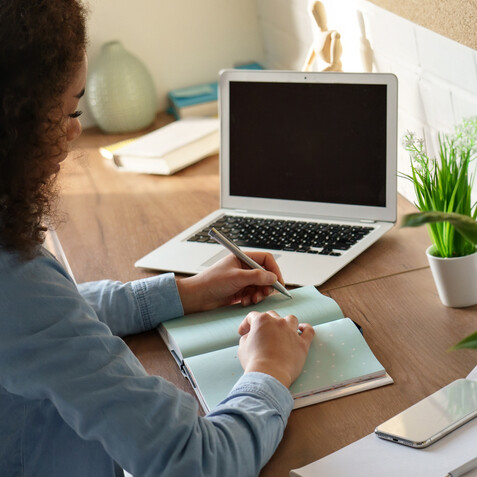 Administrative professional documenting her procedures