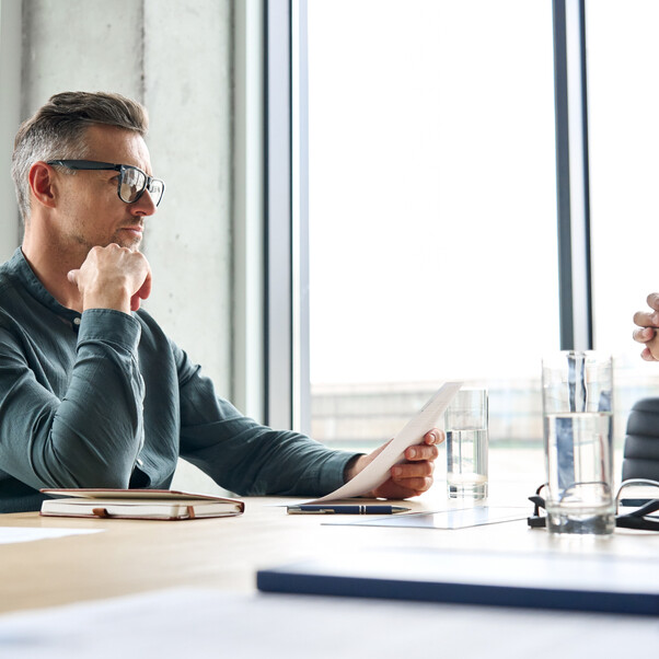 Male admin improving his processes and systems with a mindset of continuous improvement