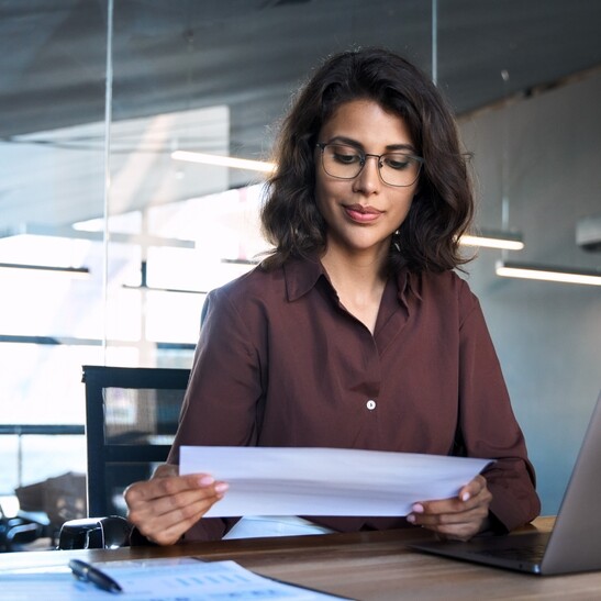 Admin looking through data and making interpretations for her executive