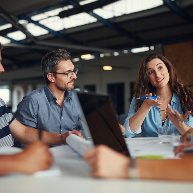 Administrative professional taking initiative in business meeting