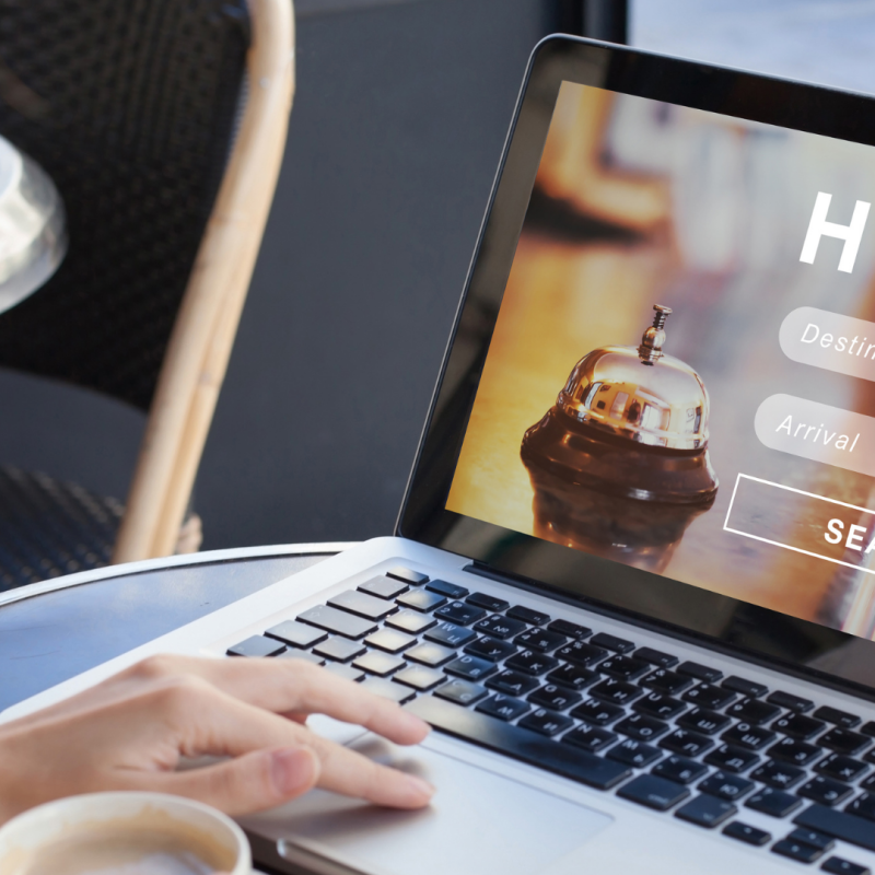 woman on laptop, looking up hotels