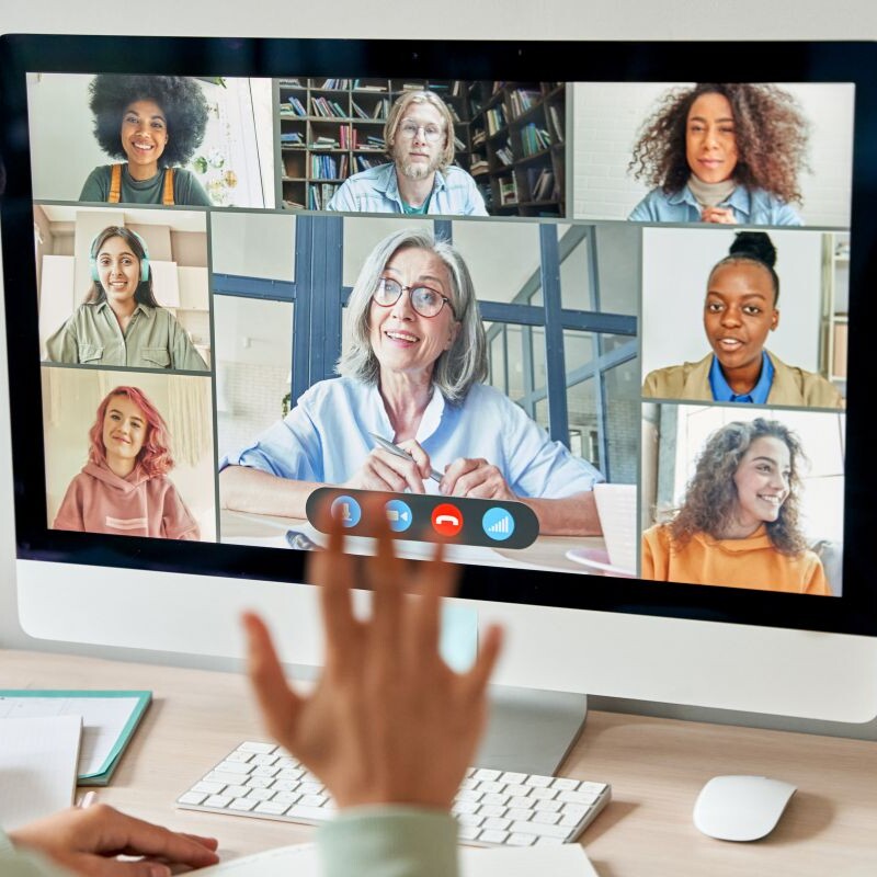 Remote team collaborating through video conferencing.