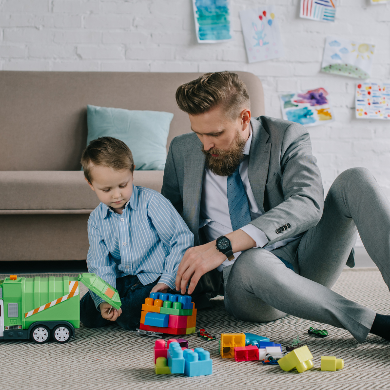 Dad playing with son. Work/life balance.