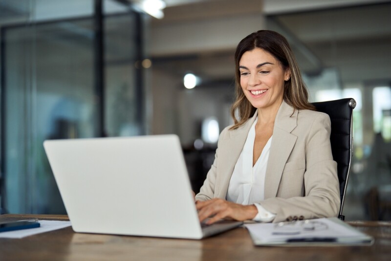 professional woman sitting at laptop