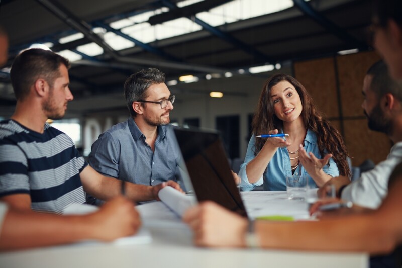 Administrative professional taking initiative in business meeting