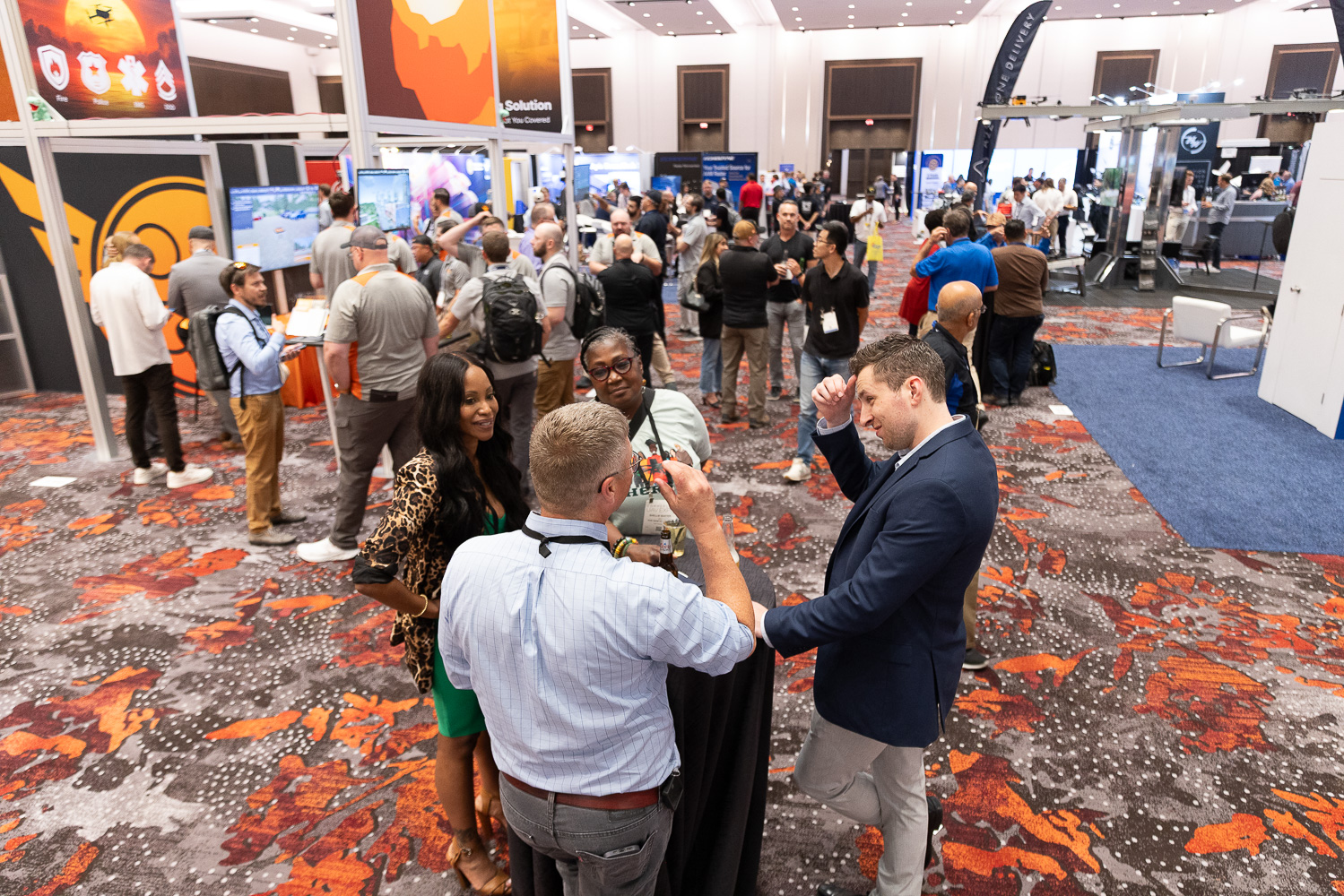 Groups networking at Commercial UAV Expo 2025