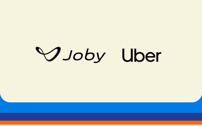 Joby Aviation and Uber's logos on a beige backdrop