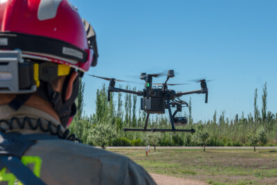 latin firefighter piloting rescue drone