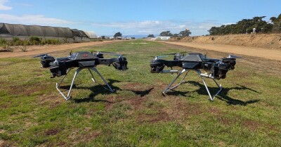 Two Firefly drones on the ground next to each other
