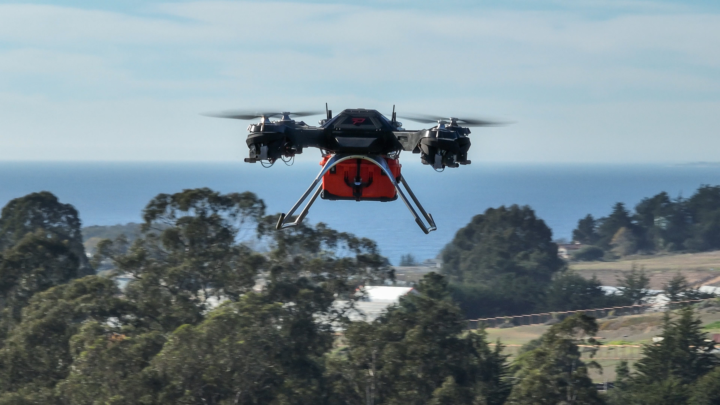 Firefly drone flying over trees
