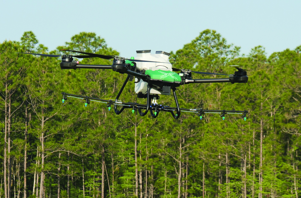 Central UAS Technologies drone flying that is equipped with pesticide sprayer