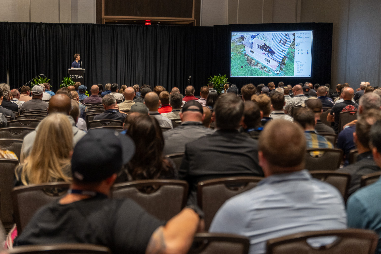 Crowd watching presentation at Commercial UAV Expo 2025