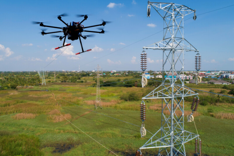 Drone stringing transmission lines for installation of electrical high power. stringing via our method innovation reduces cost and risk for electric utilities