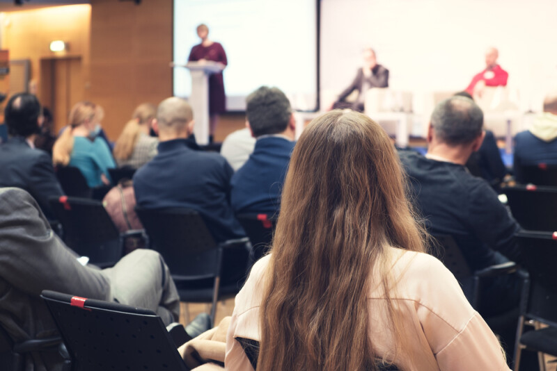 Business woman and people Listening on The Conference. Horizontal Image