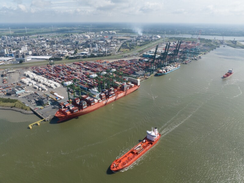 Aerial image of Port of Antwerp with cargo ships in the channel