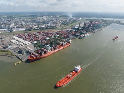 Aerial image of Port of Antwerp with cargo ships in the channel