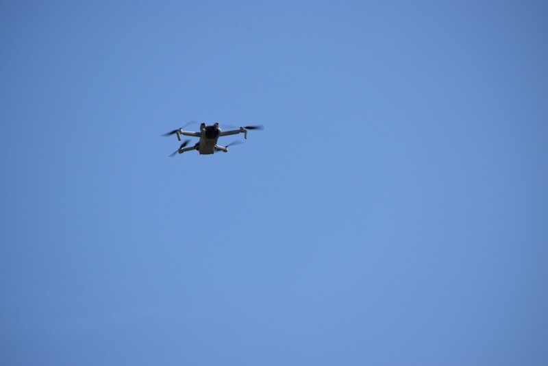 A UAV flying against a clear sky backdrop