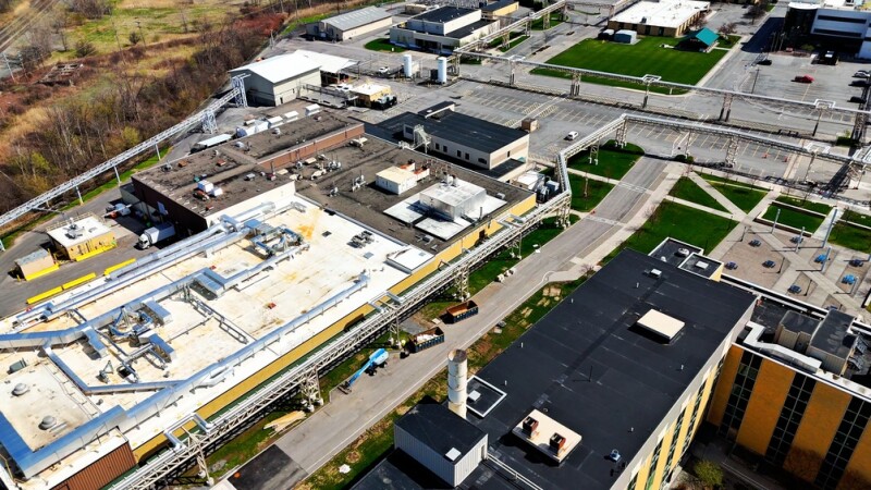 Aerially changing position over a facility that operates for the purpose of handling manufacturing for both clinical trials and commercial drug launches.
